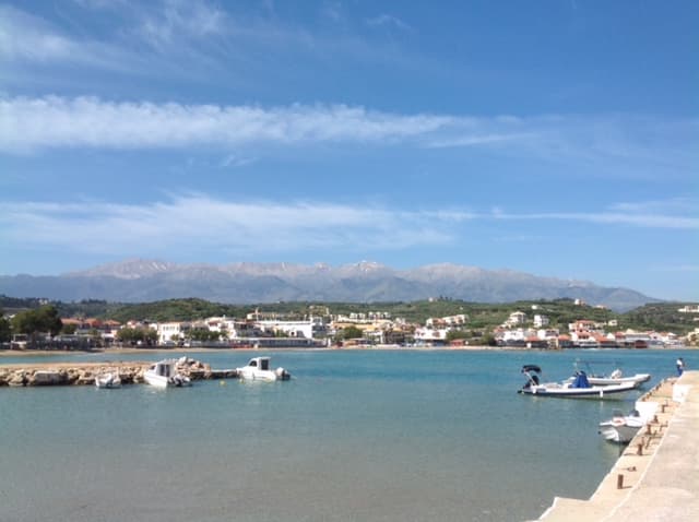Kalyves beach with sandy bay and tavernas along the shoreline