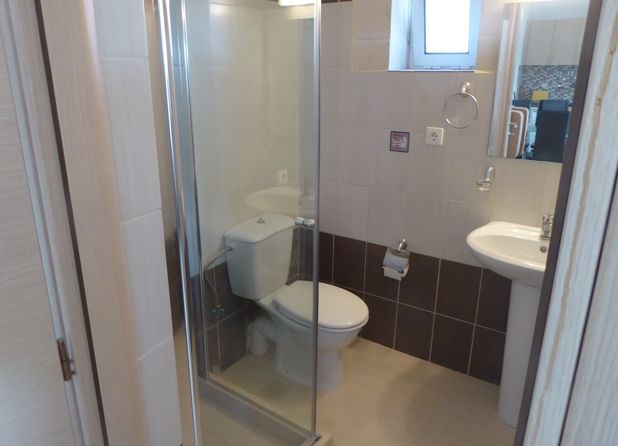 The bathroom with walk-in shower